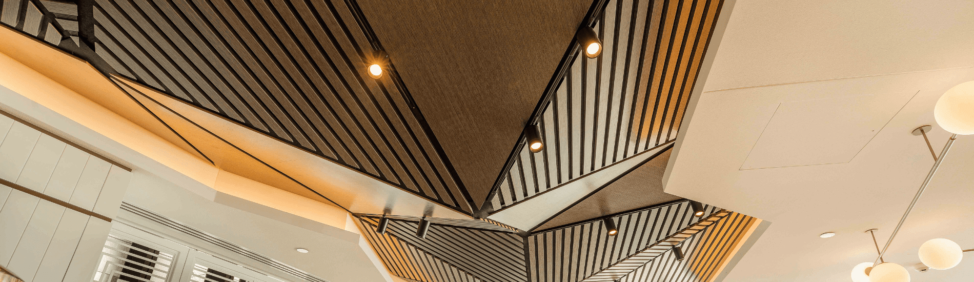 Complex and irregular custom SUPASLAT creates mountain range effect on hotel ceilings