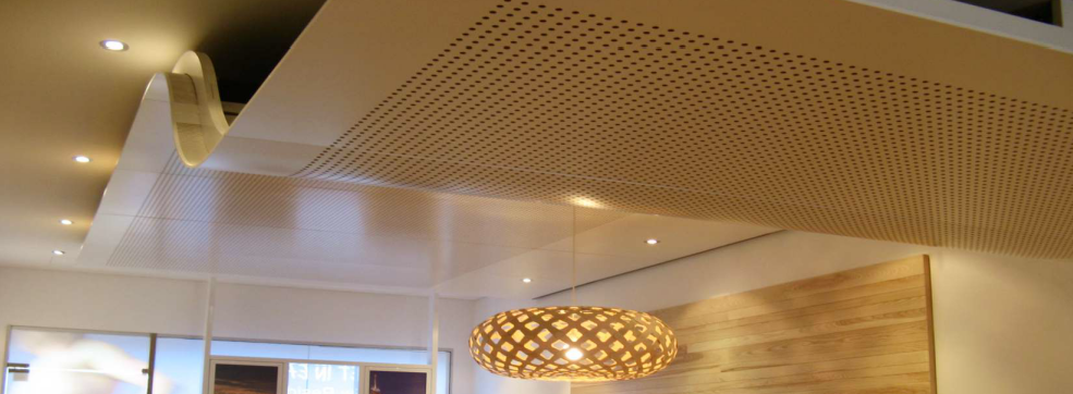 Decorative curved ceiling in perforated acoustic panels.