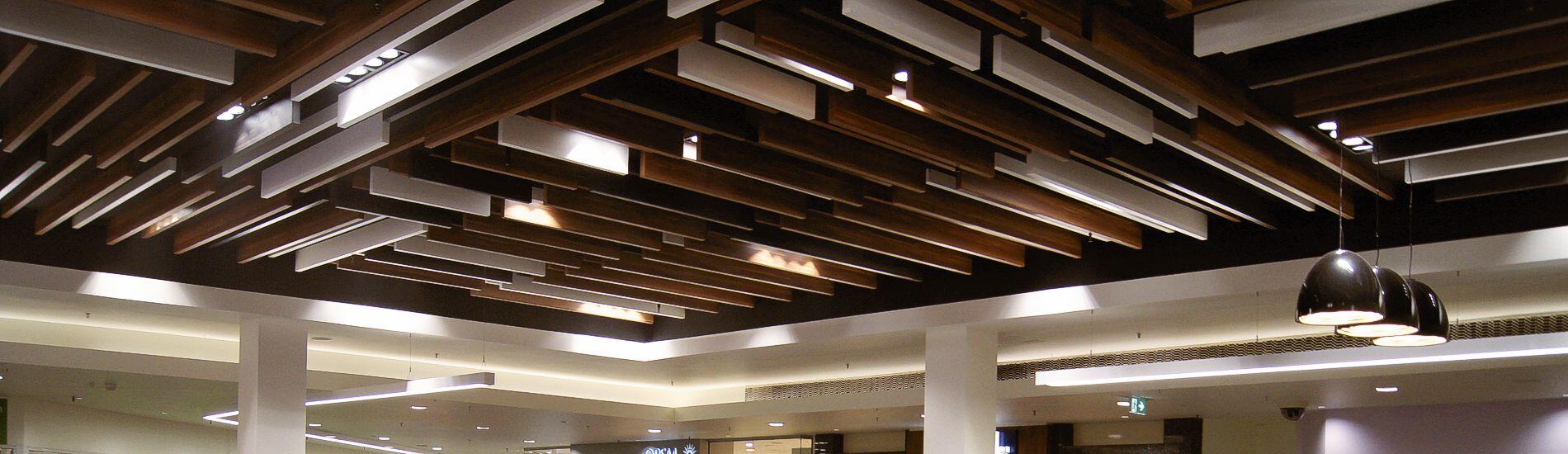 Decorative use of MAXI BEAM in mixed profiles and finishes for feature shopping mall ceilings