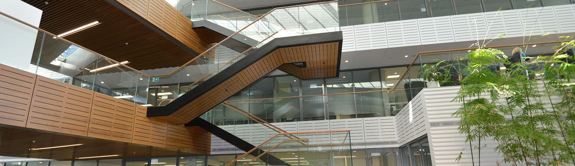 Mix of SUPAWOOD Acoustic and Slatted Lining Products Used Extensively in Atrium of Commercial Building