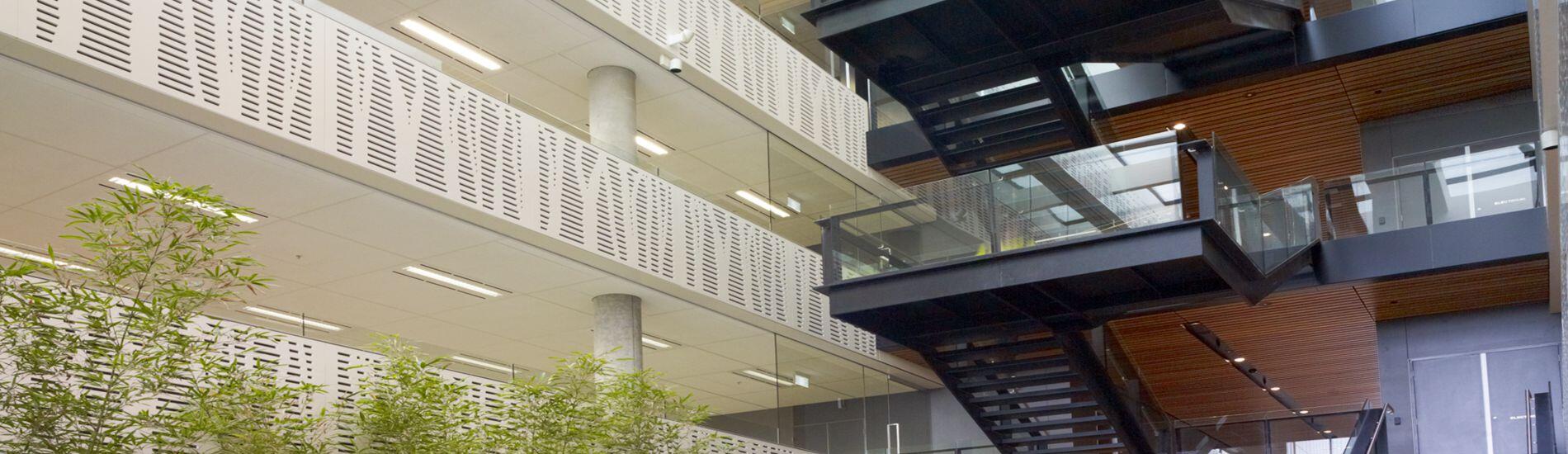 Custom Tree Pattern SUPACOUSTIC Acoustic Panels and SUPATILE SLAT Ceiling Tiles Enhance Commercial Atrium