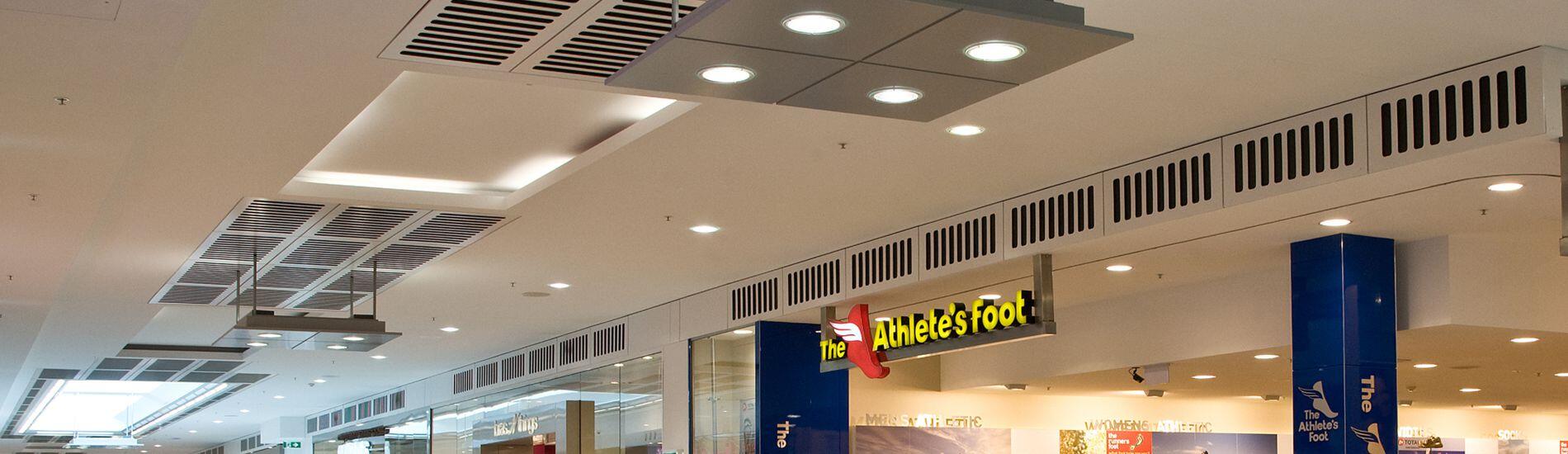 SUPACOUSTIC custom slotted panels help to integrate air flow in shopping centre