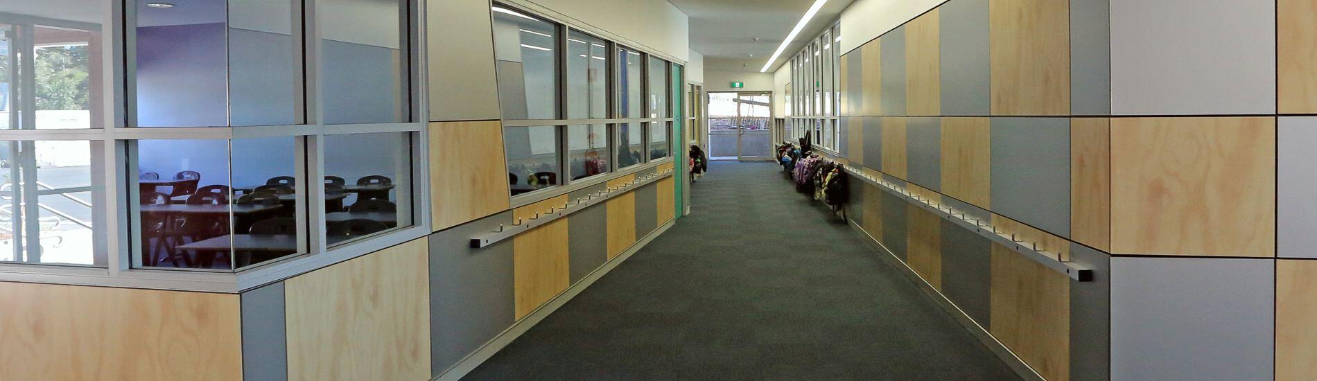 Aesthetic use of SUPALINE decorative BCA compliant panels for school corridors
