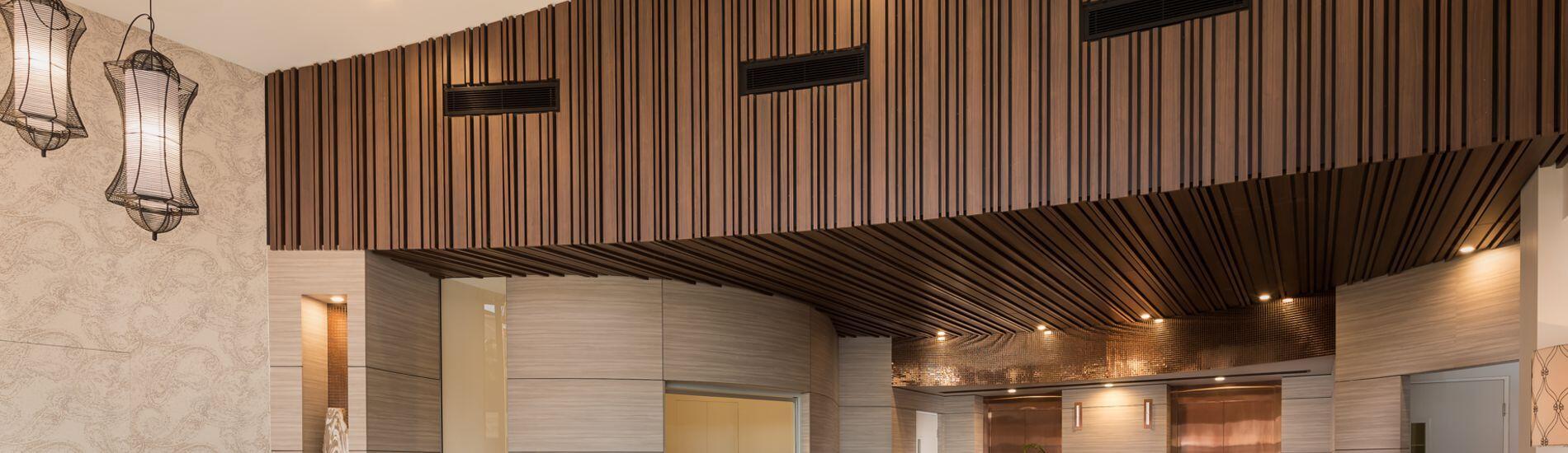 Random Profile SUPASLAT Slatted Acoustic Panels Address Noice Reverberation In Foyer