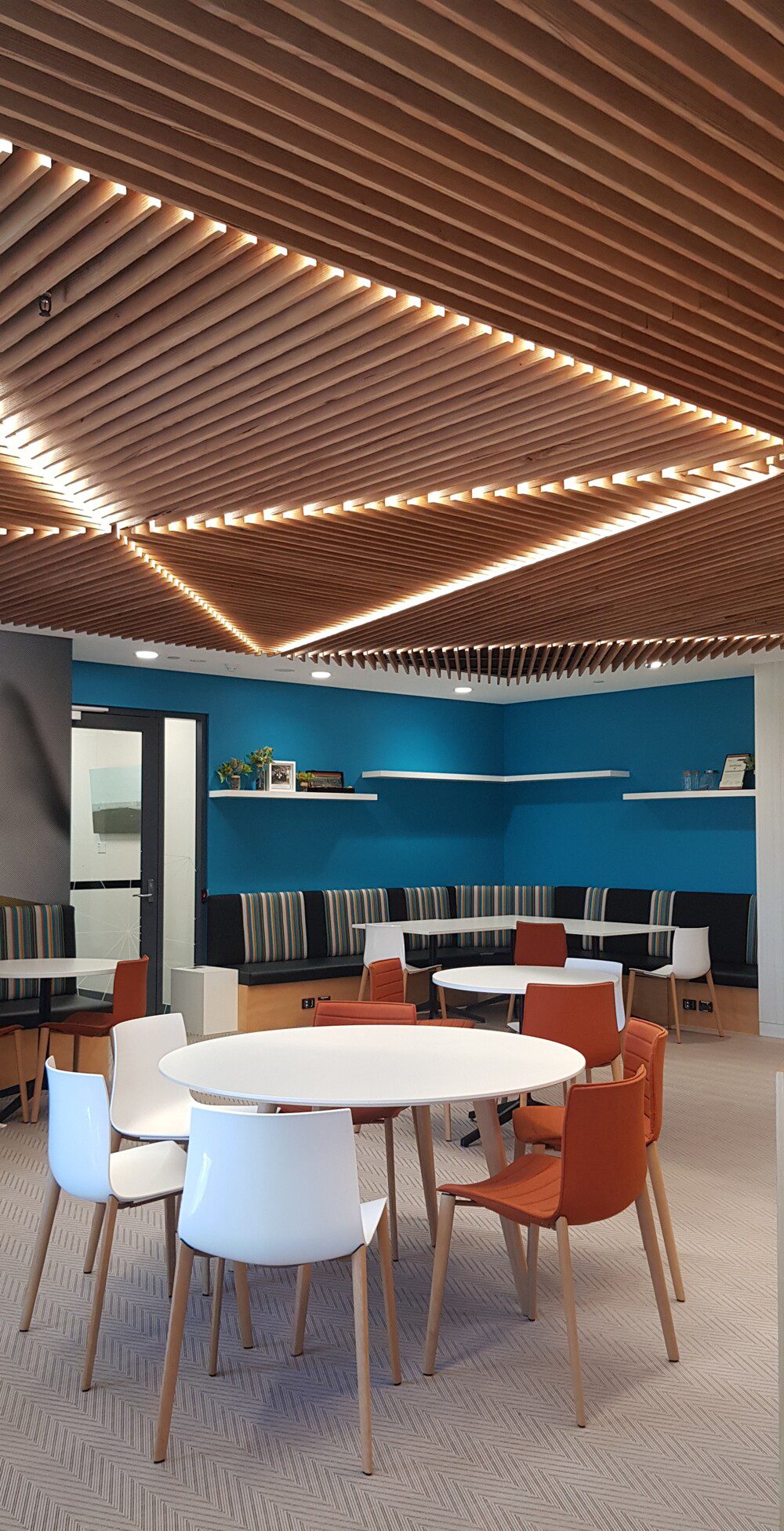 Geometric directional ceiling in a staff hub.